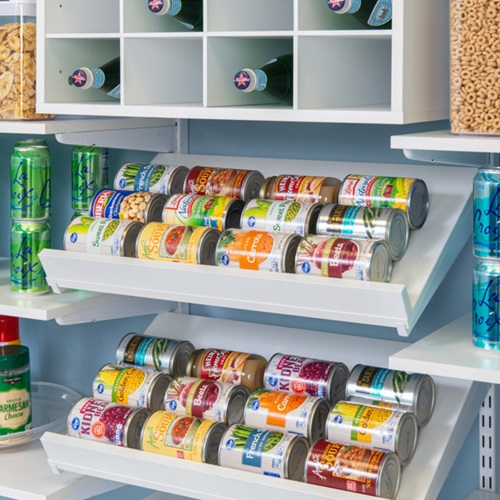 freedomRail Reach-in Pantry in White with tiered shelves with canned food items, turn tables and beverages with blue walls.
