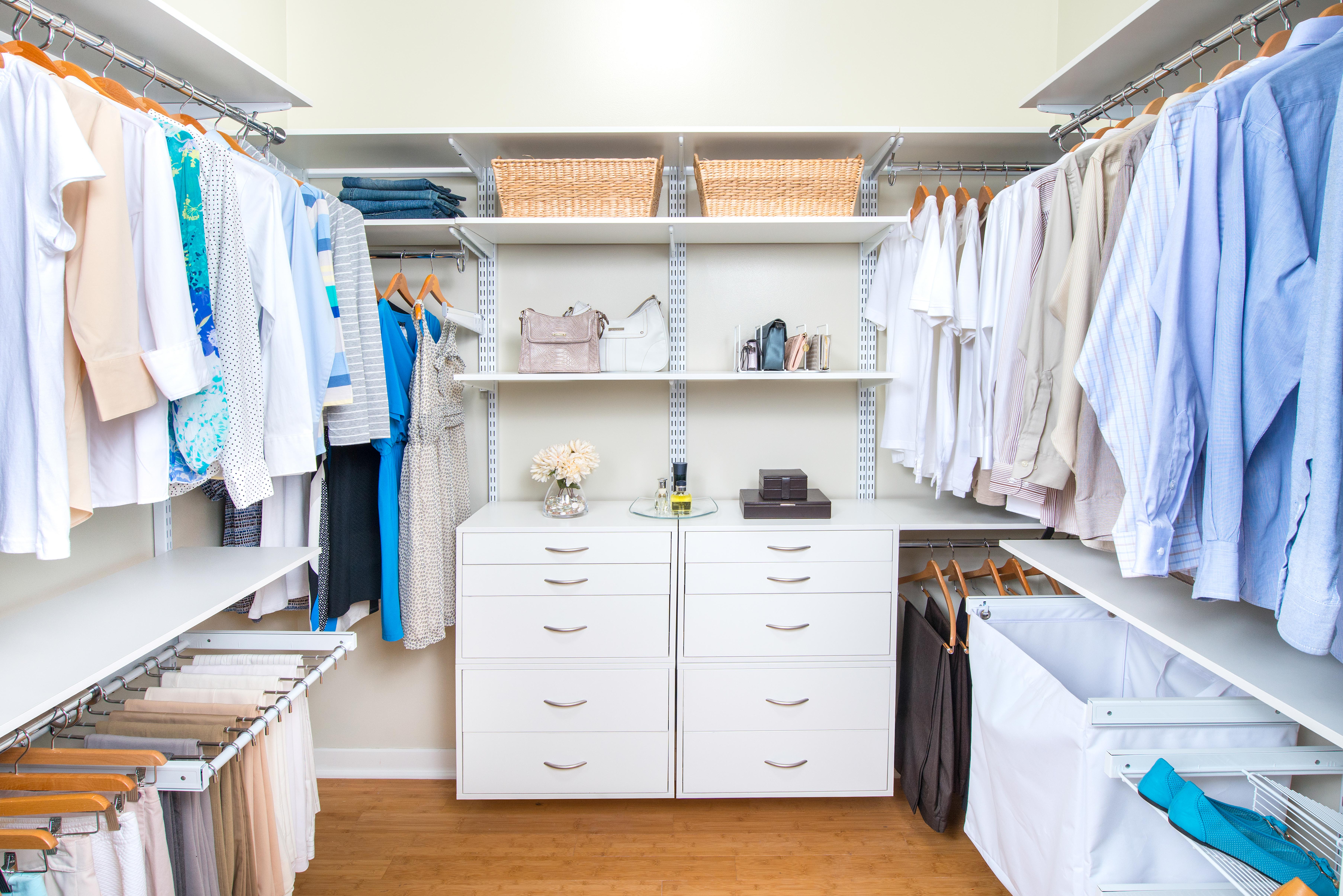 freedomRail Walk-in Closet in White with men and women's clothing.
