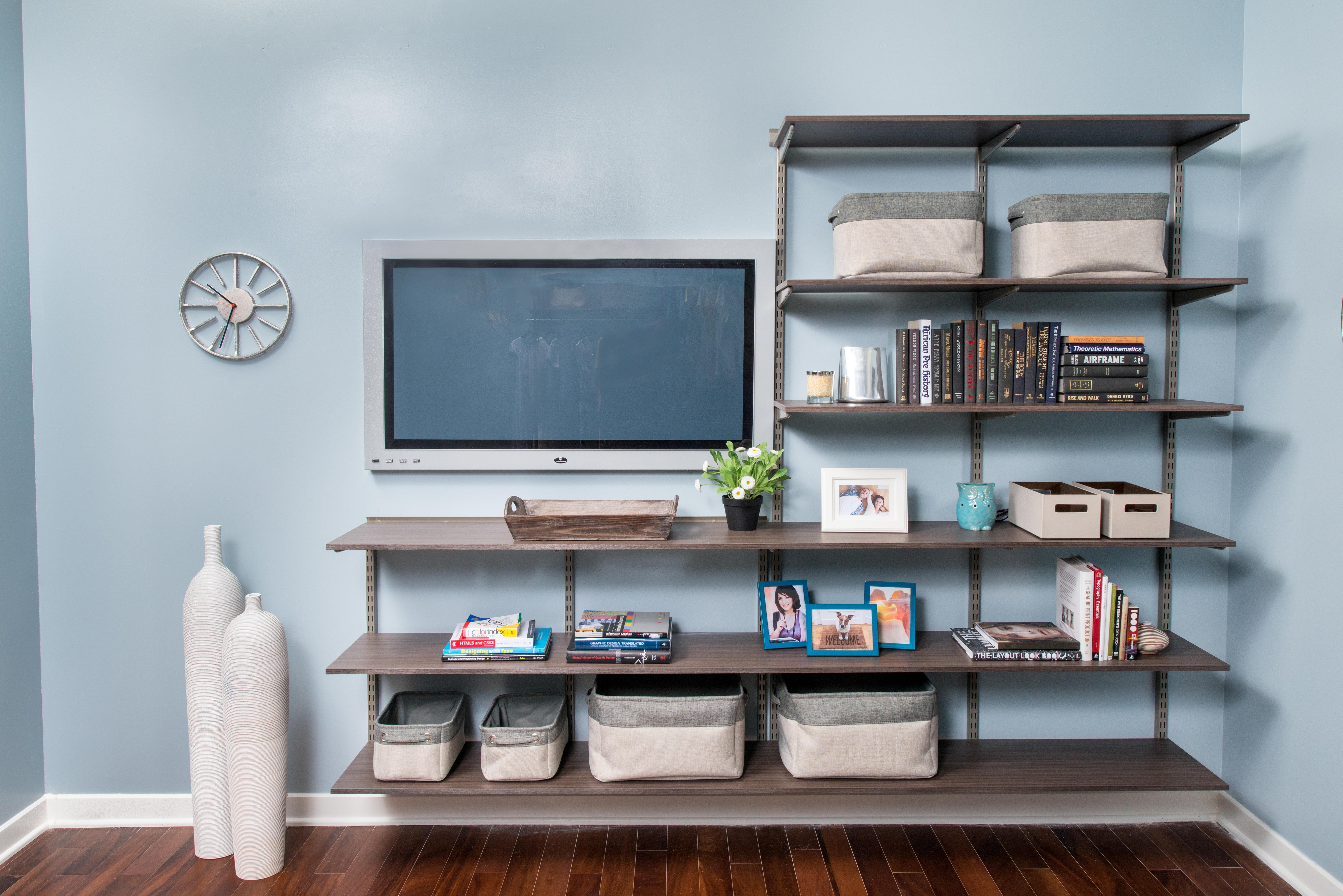 freedomRail Driftwood Live Entertainment Center with books, baskets, and TV.