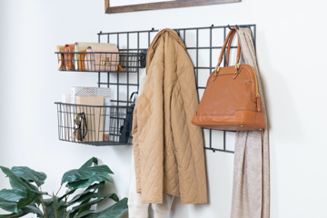 Activity Organizer Kit in Nickel with women's purses and coat.