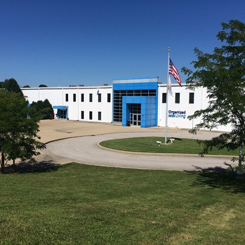 Bloomington plant with landscape and flag pole.