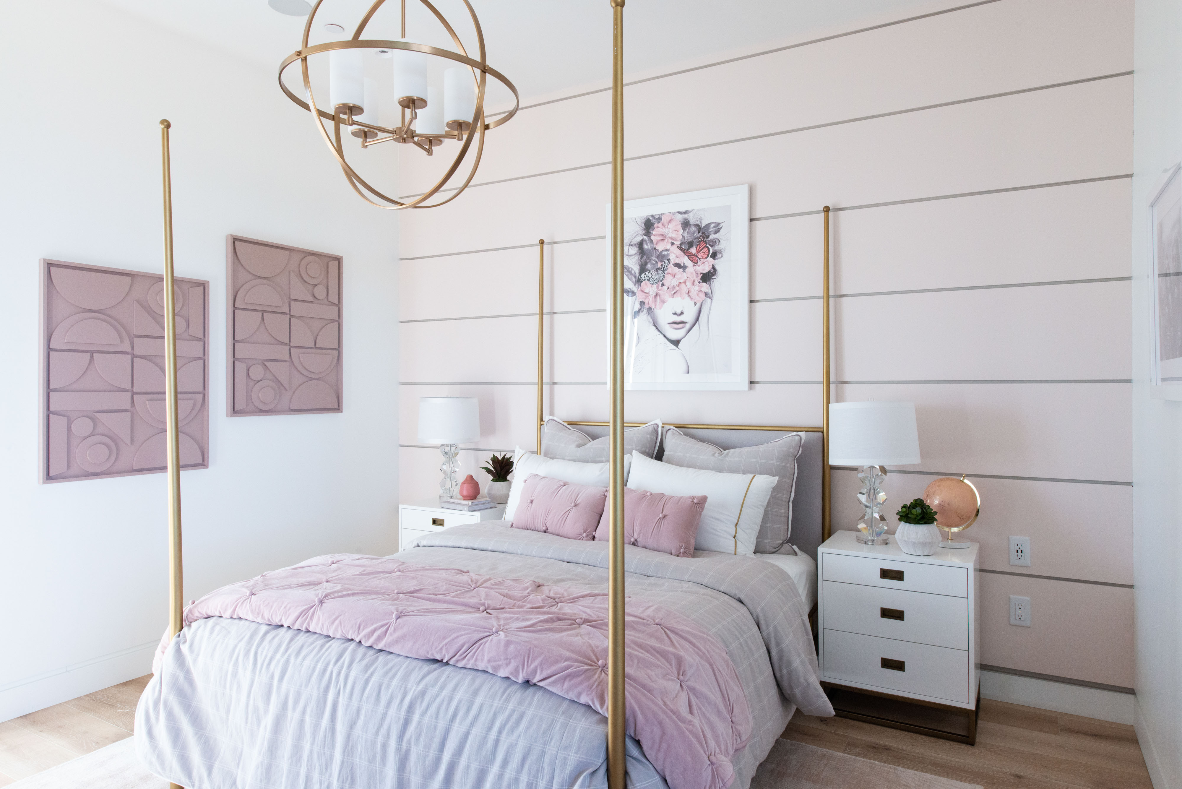 Chowa House Photo Shoot with white nightstands and 4 post gold bed frame.