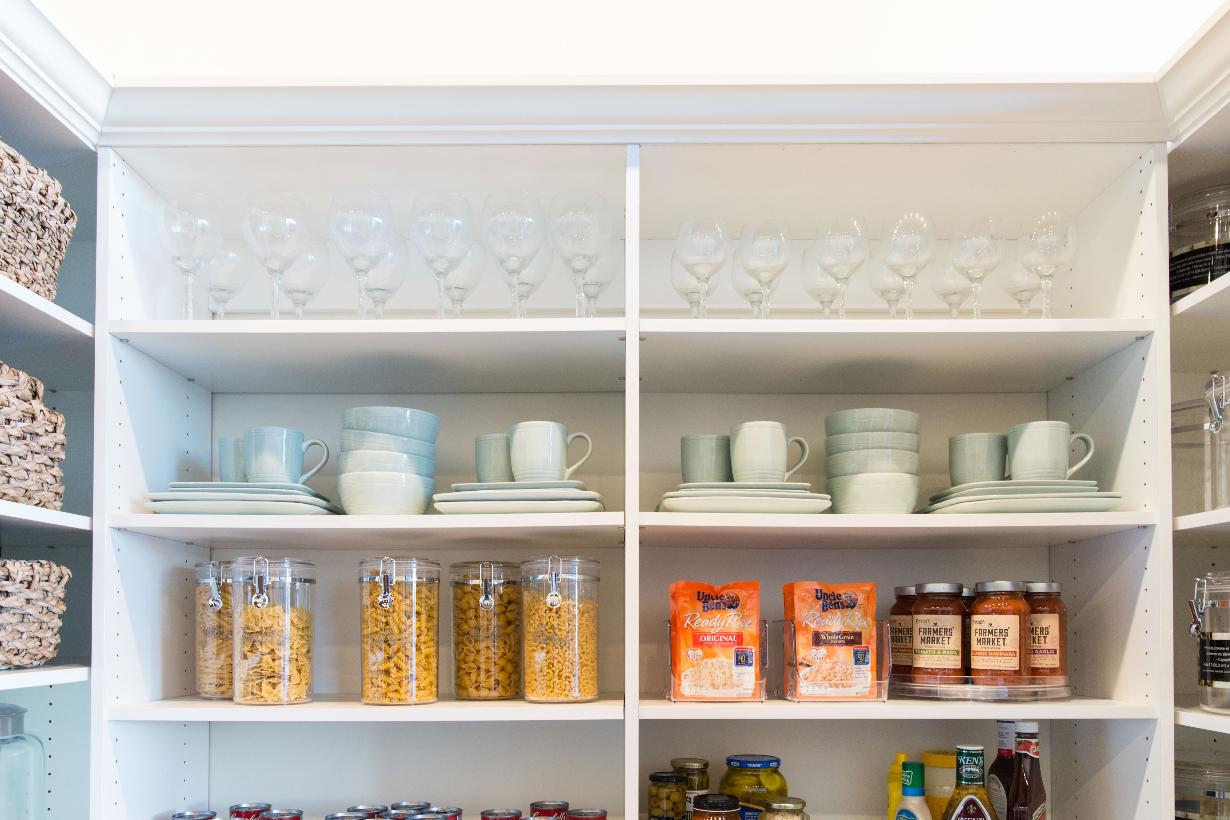 Classica Pantry in White with glassware and dinnerware in top shelves.