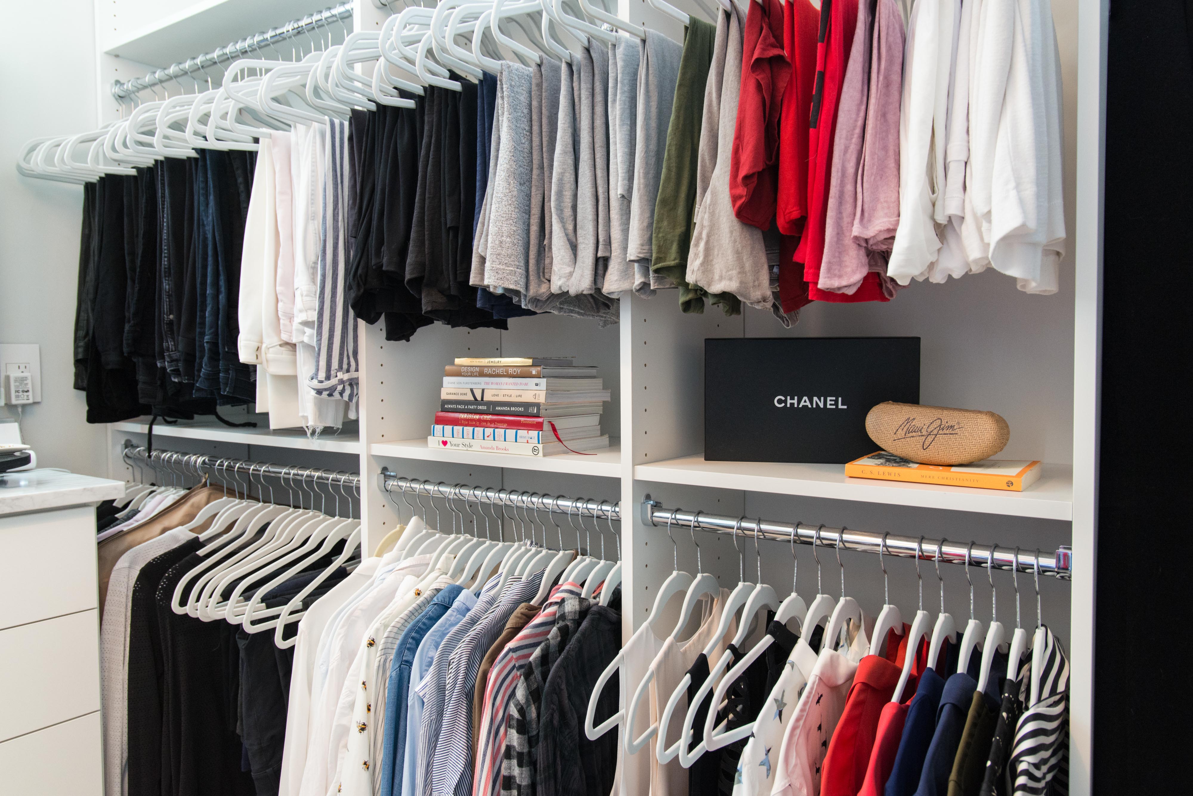 Classica Walk-in Closet in White with organized women clothing and decor.