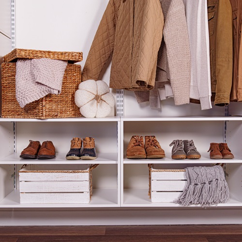 freedomRail Mudroom in White with fall decor, brown neutral toned clothing and accessories.