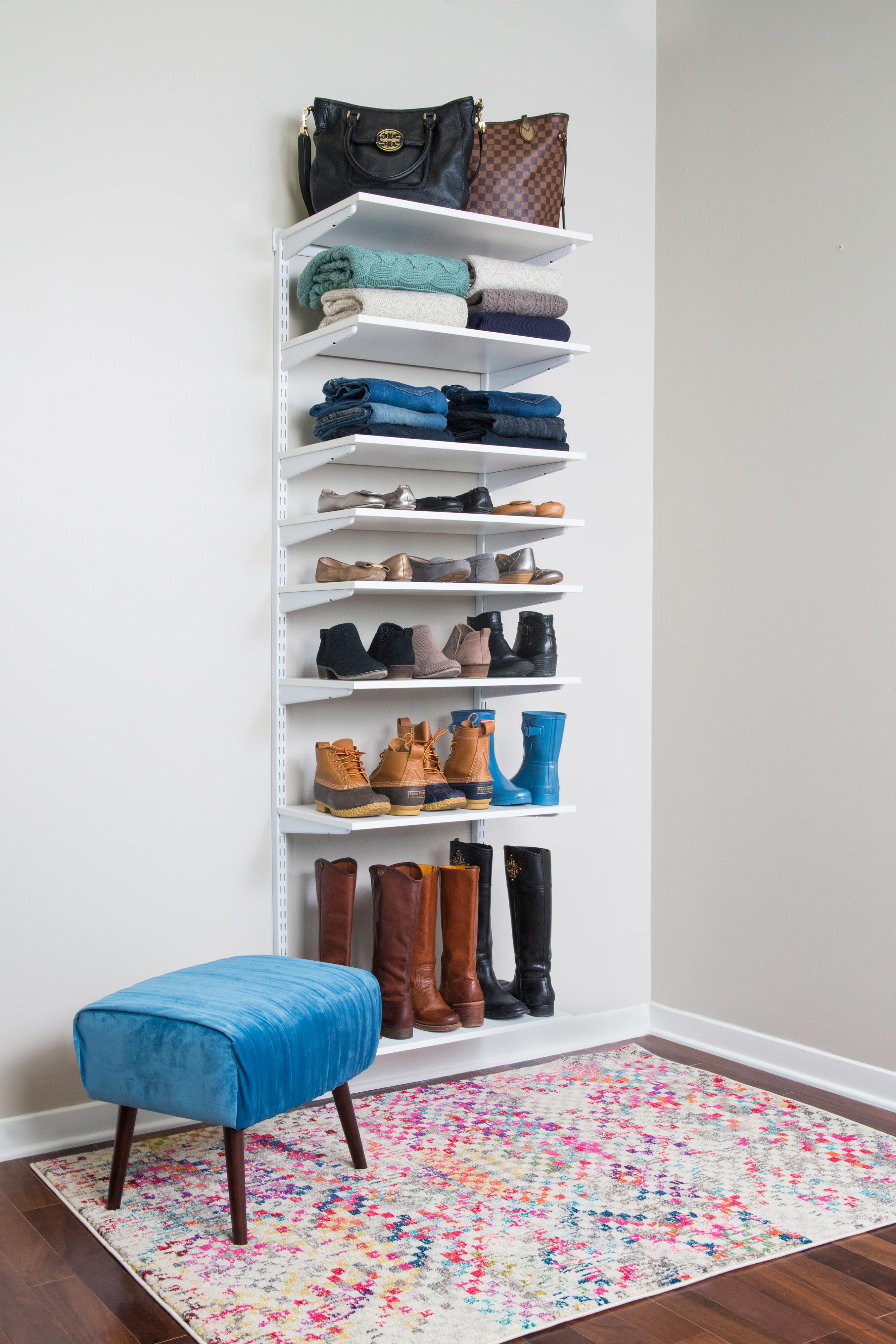 freedomRail Shelf Stack of 8 in White with women's shoes, accessories and clothing.