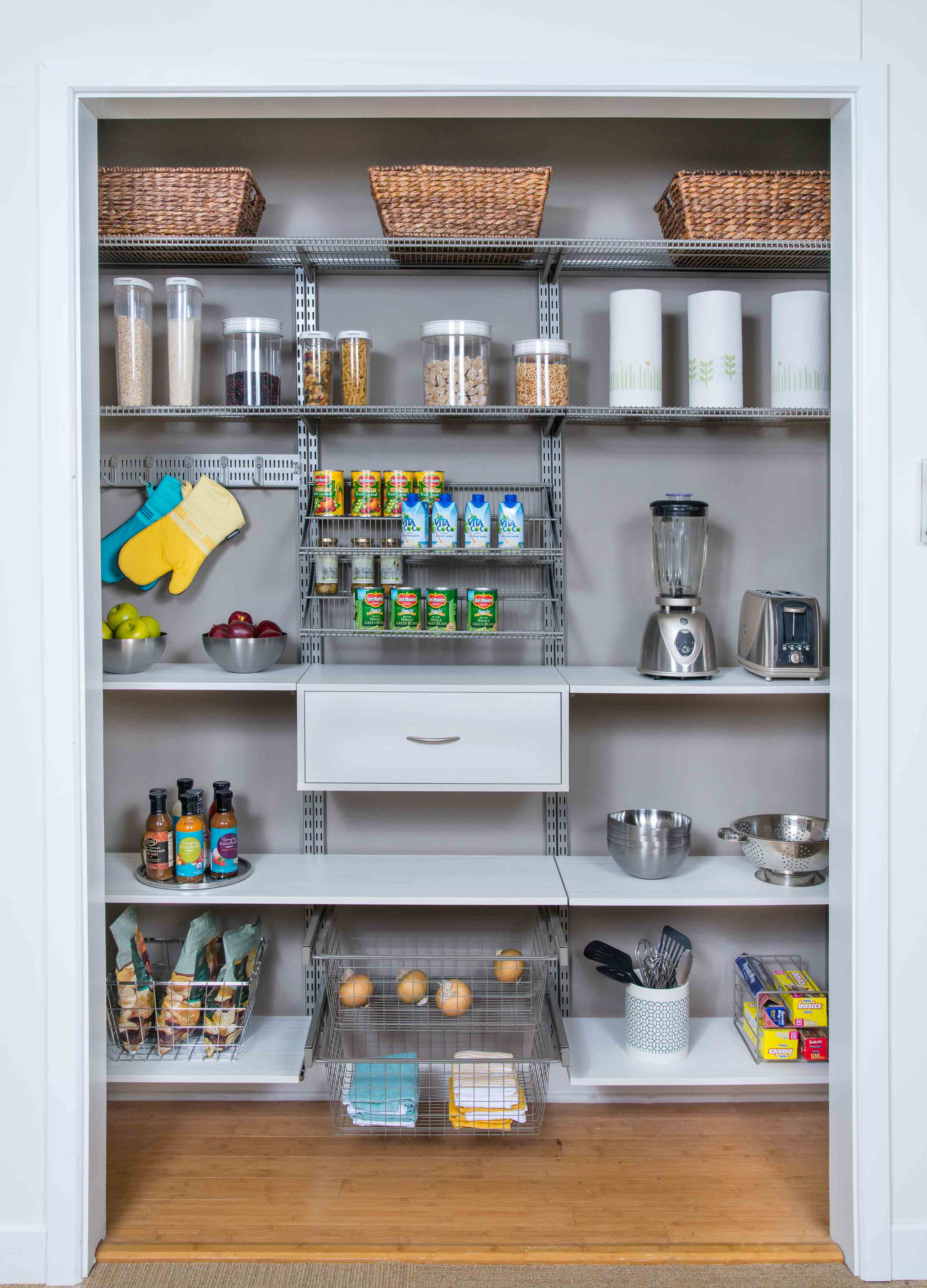 freedomRail Snowdrift Live Pantry with baskets and canned goods.