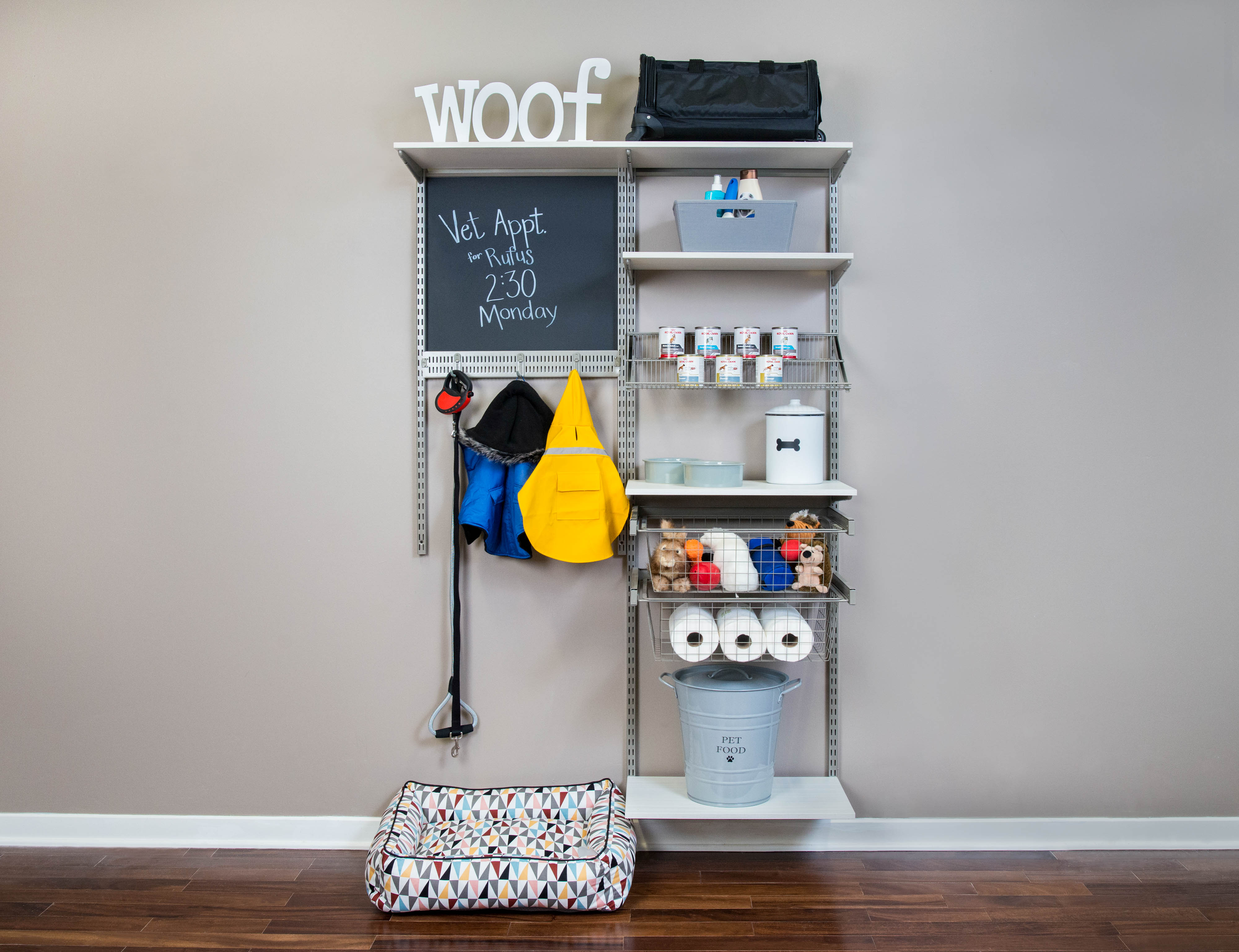 freedomRail Snowdrift Pet Mudroom with pet food and bed.