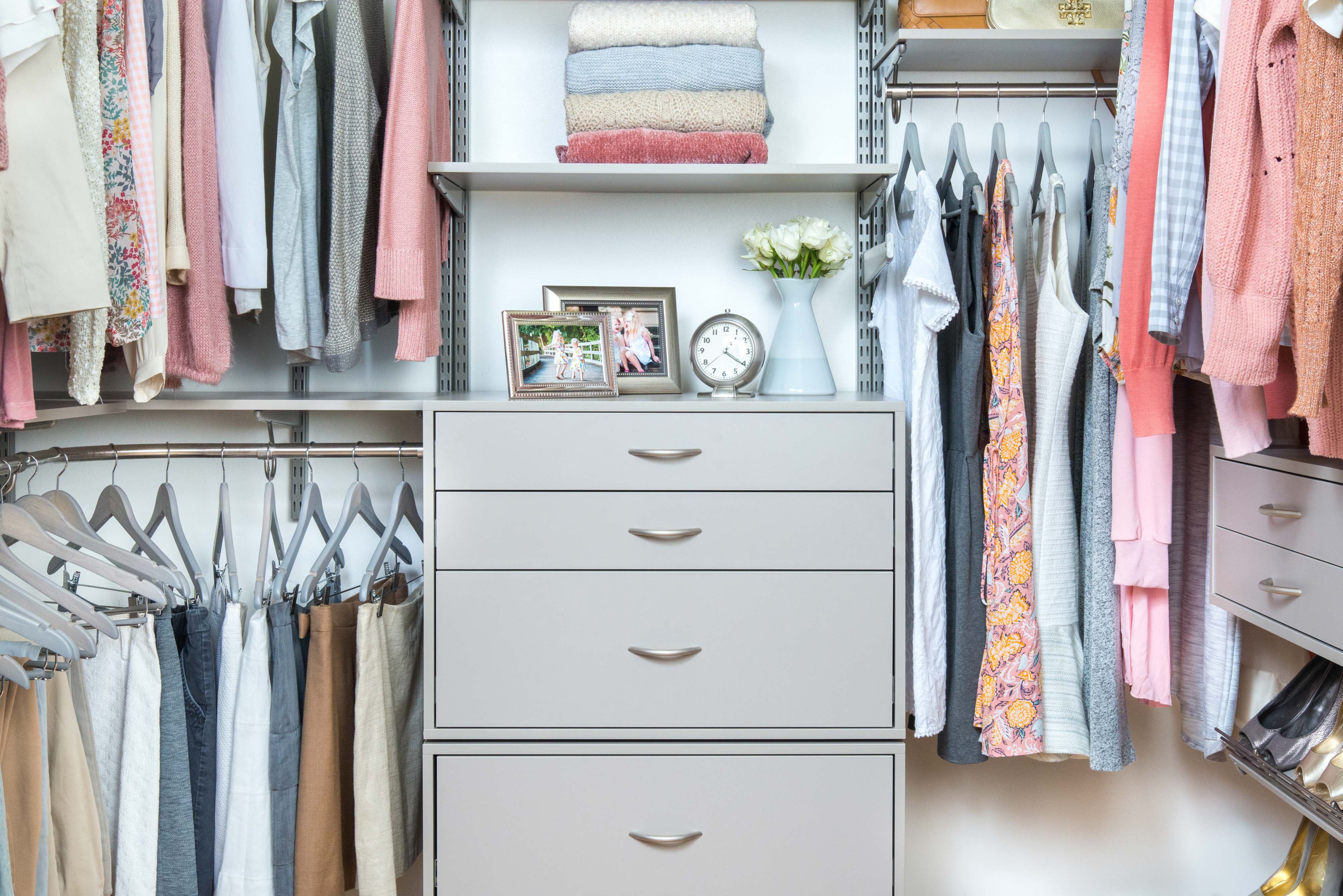 freedomRail Walk-in Closet in Century Gray with women's clothes, shoes, and décor. 