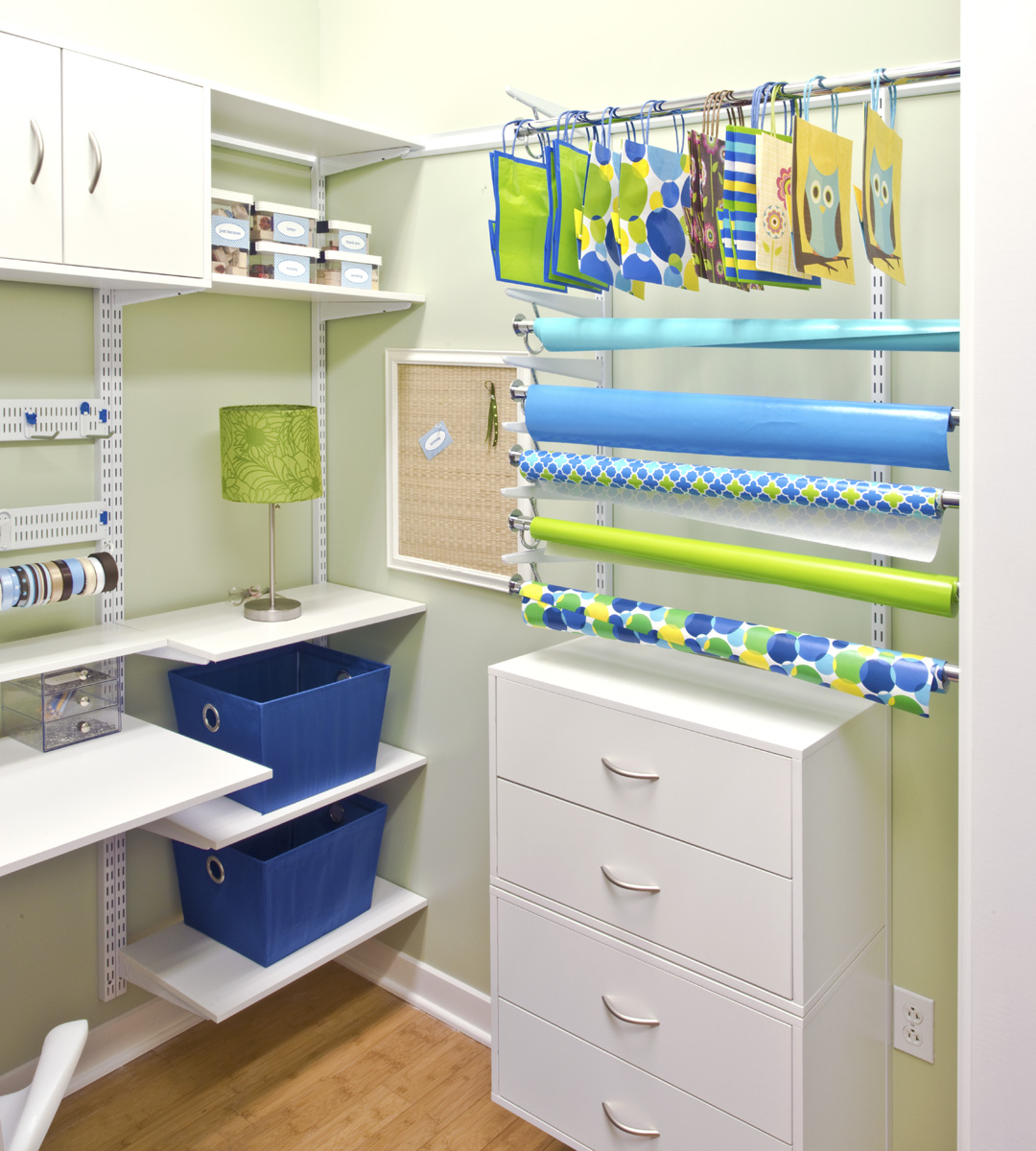 freedomRail White Hobby Room with blue and green decor, green walls, and wrapping paper.
