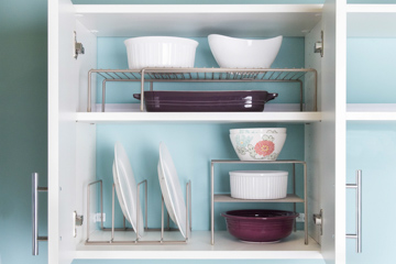 Kitchen Organizer in Nickel with purple dinnerware and blue background.