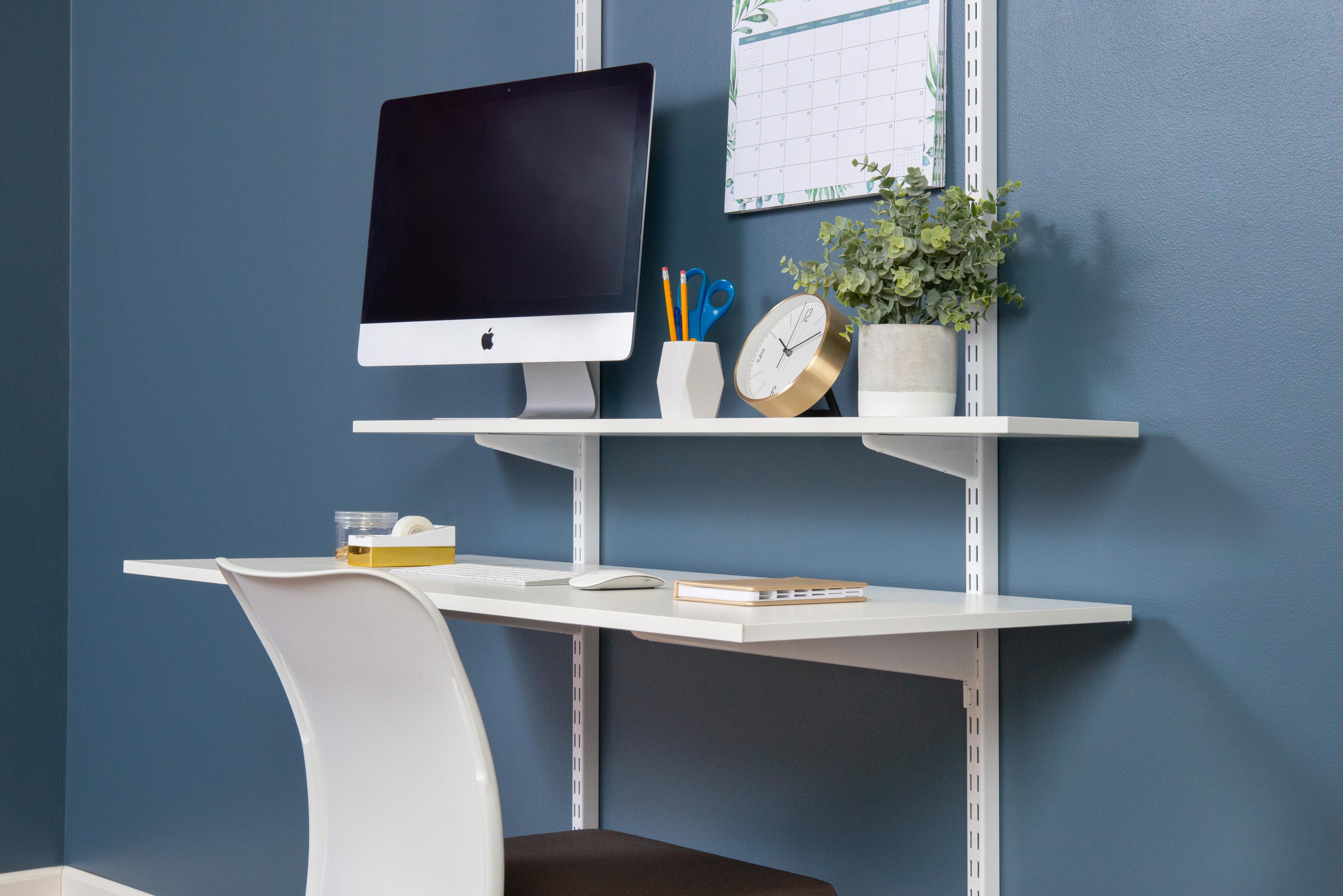 freedomRail Office in White with monitor, chair, and blue background.