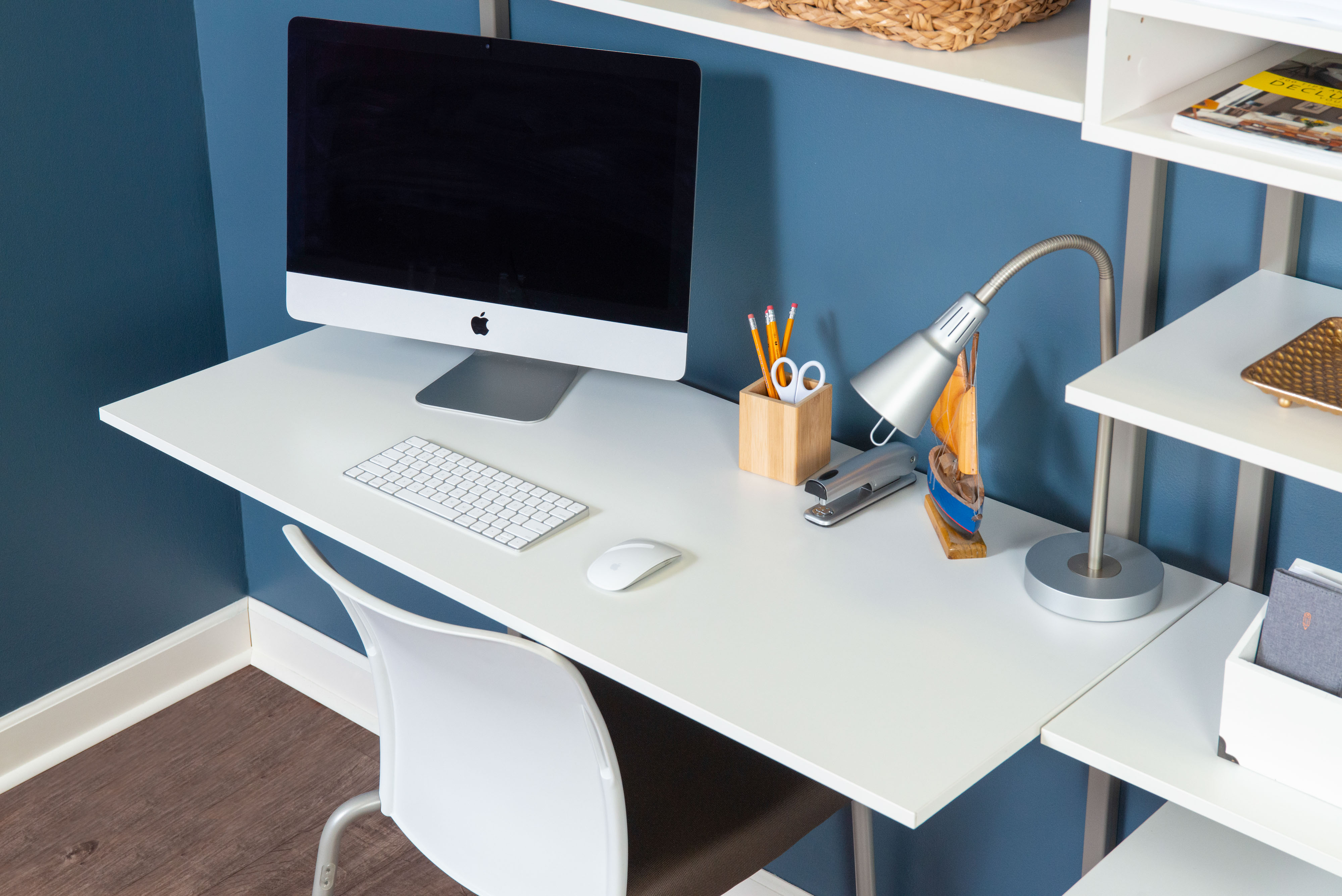 freedomRail White Dual Desk Office with close up of desk with monitor, keyboard, mouse, lamp and office supplies. 