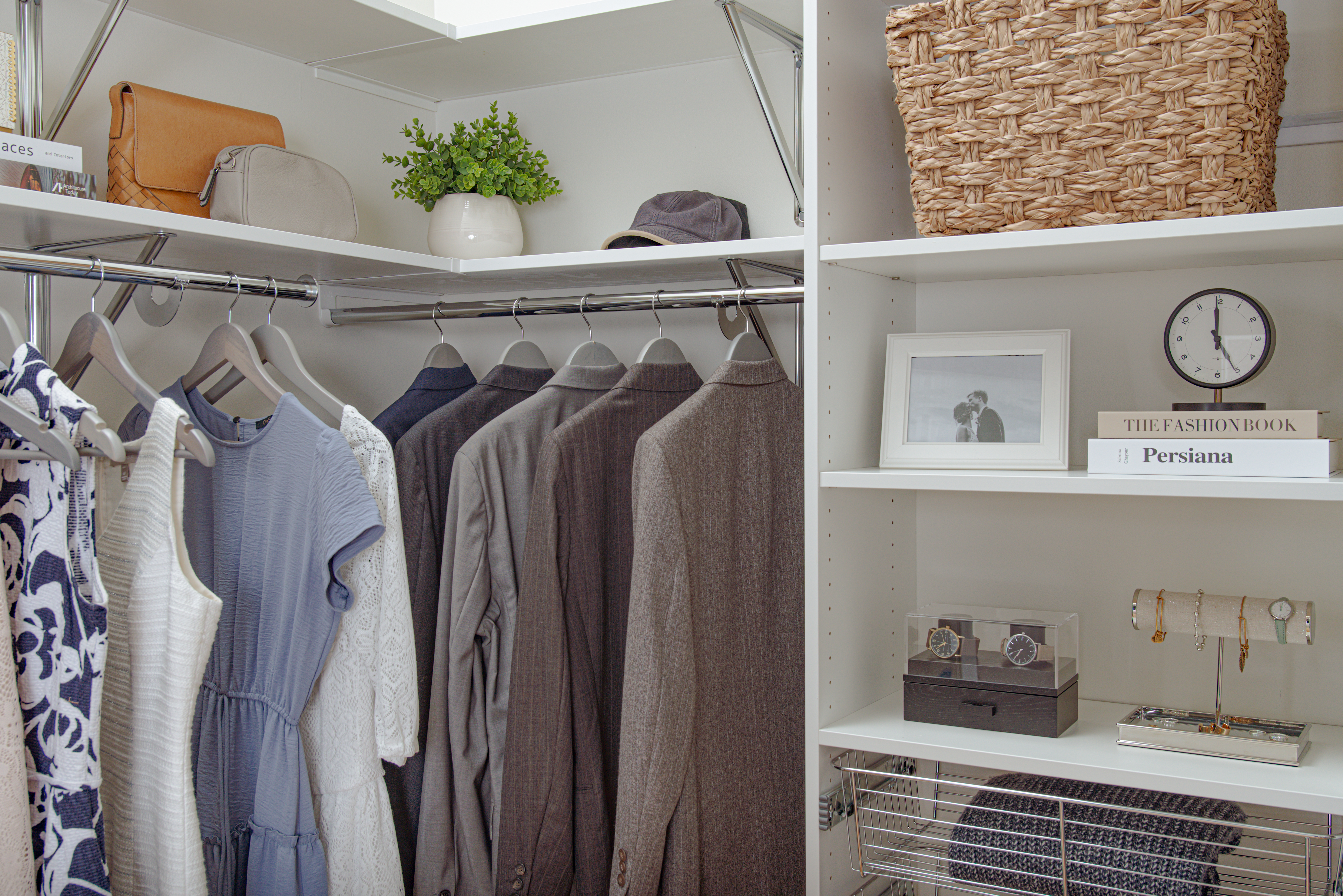 VUE - Metal Brackets - with women and men clothing, blue accents, and neutral background.
