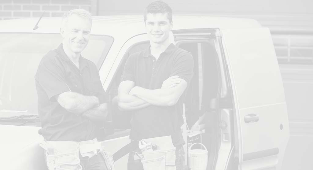 2 Installing Dealers Standing in front of a work van