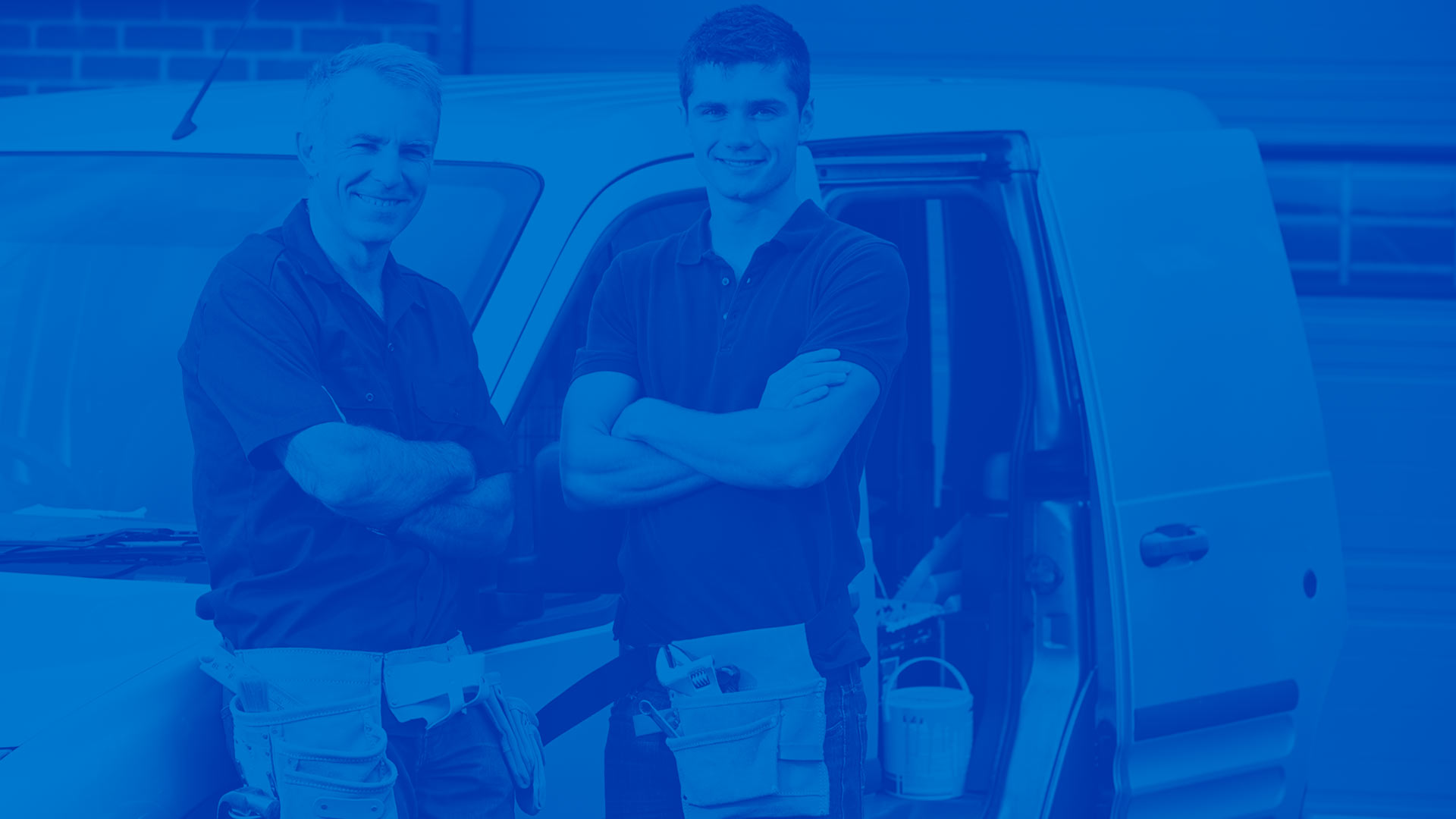 Two male contractors in front of a van. Blue overlay on image.