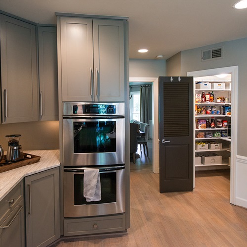 freedomRail Walk-in Pantry in White with kitchen and storage baskets.