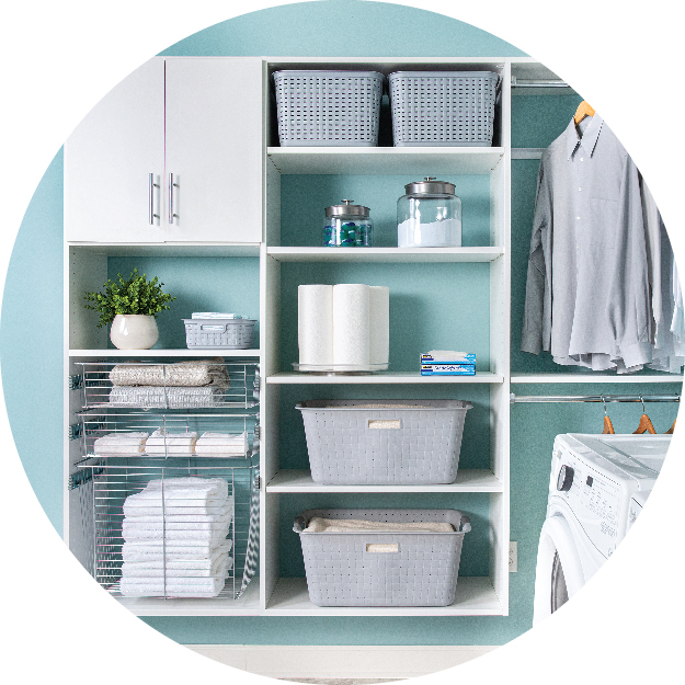 Circle cropped image of White Select Laundry Closet by Organized Living propped with laundry items such as: detergent, softener, laundry baskets and clothing.