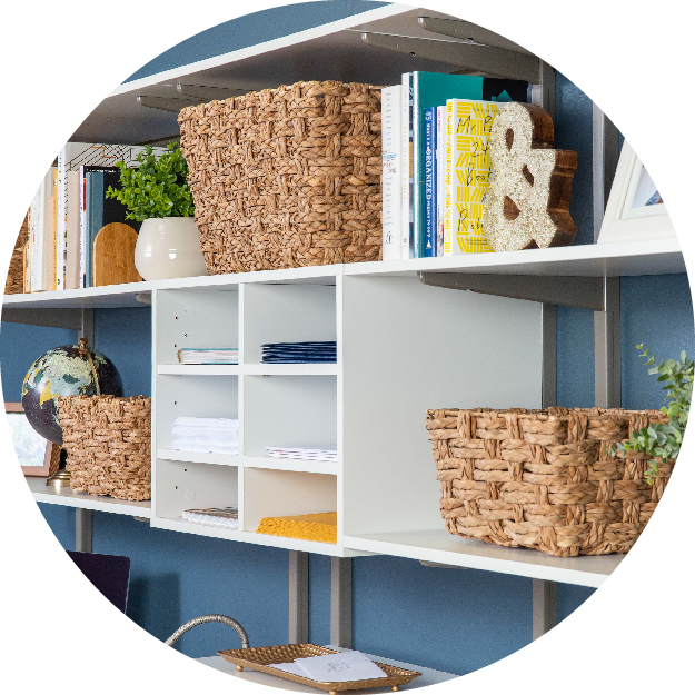 Circle images cropped of white freedomRail office configuration propped with office and desk supplies