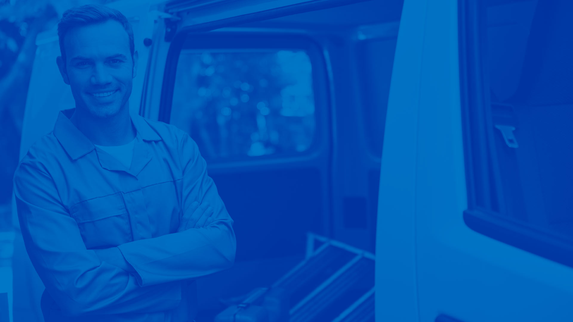 Man in front of work van