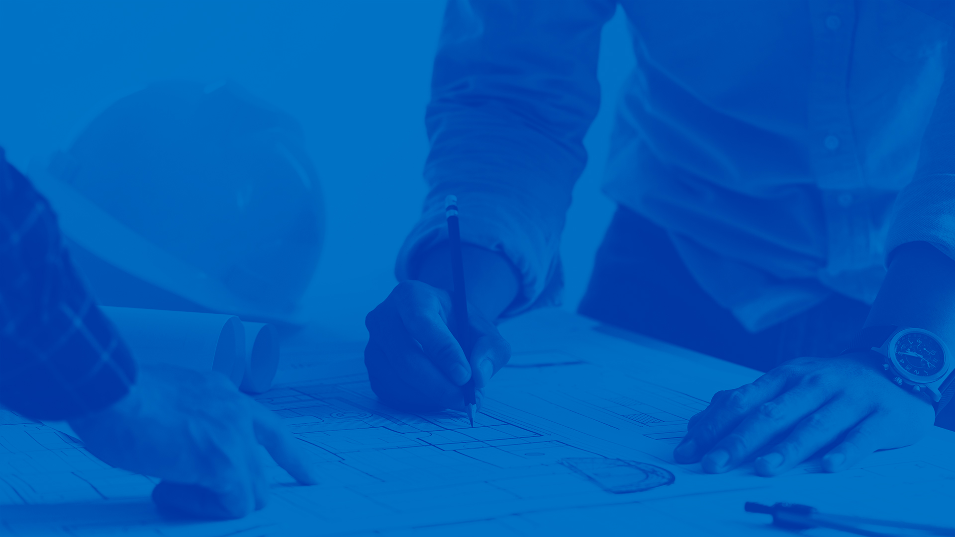 This image contains people working on contracting plans. The image has a blue overlay on it.