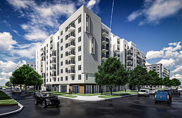 Eight-story white residential building with trees in front, Boulevard at West River.