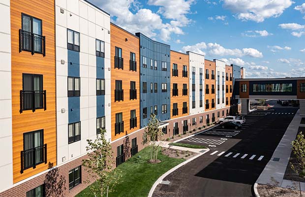 Skyview Sr. Housing is a four-story building with white and blue accents.
