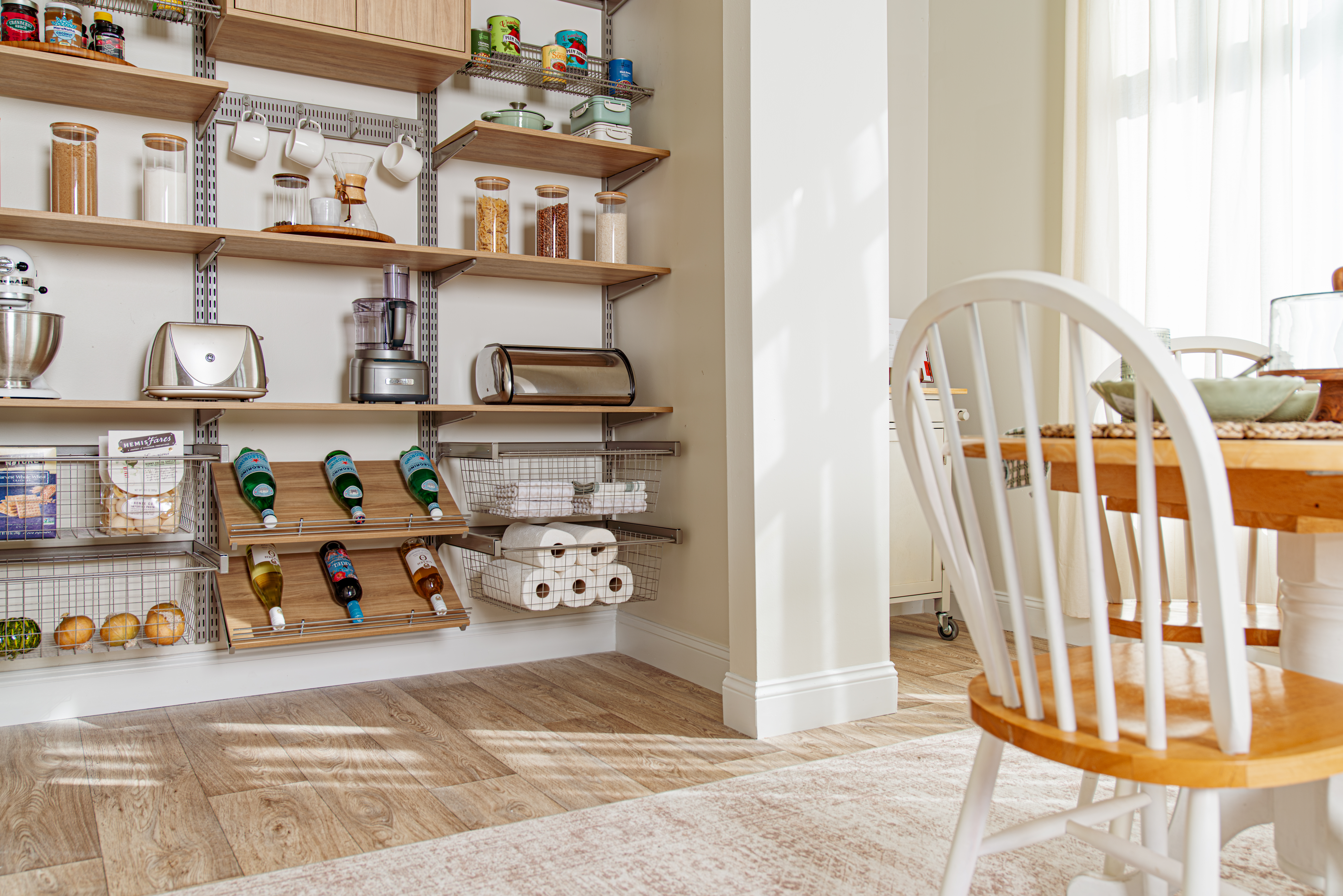 freedomRail Reach-in Pantry in Blonde Oak photograph with food and neutral background.
