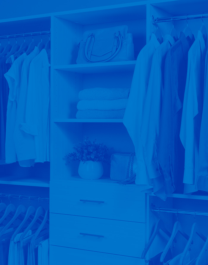 White Select closet with clothes, drawers and sweaters