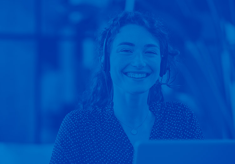 Blue overlay of a woman who is in customer support with an ear piece on her head and laptop in front of her